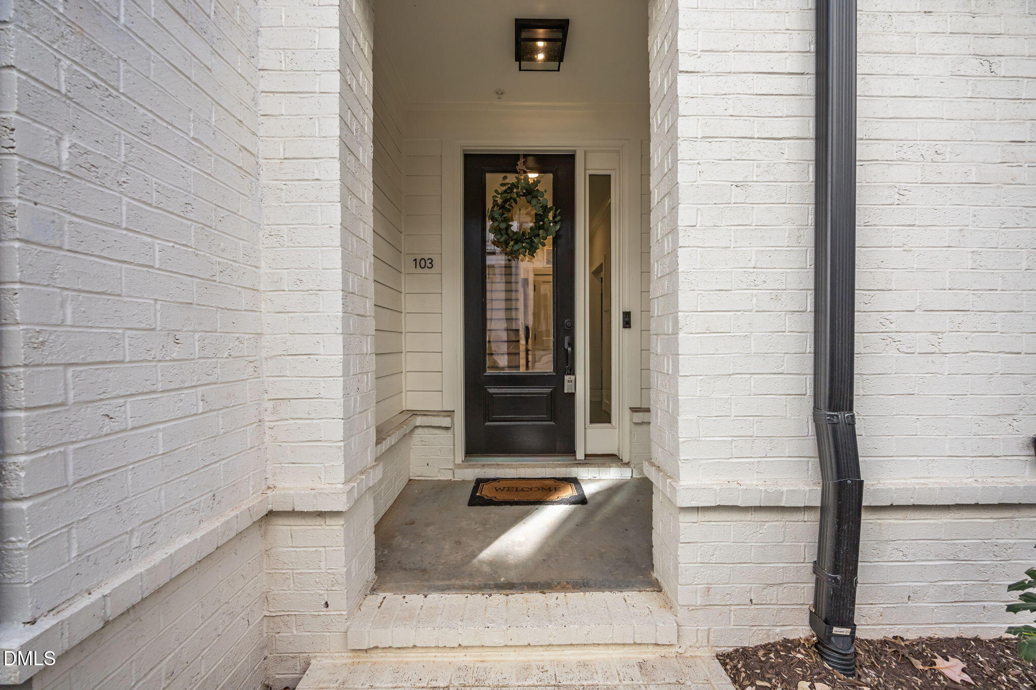 401 Bryan Pointe Drive, Unit 103 Raleigh, NC 27608 - Photo 5 of 43 a front view of a house with a window
