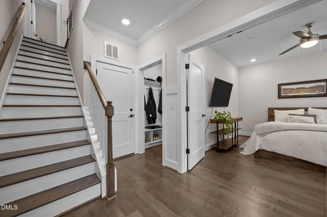 a view of a livingroom with furniture and stairs