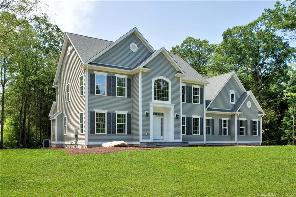 10 Mountain Spring Road Canton, CT 06019 - Photo 1 of 1 a front view of a house with a garden