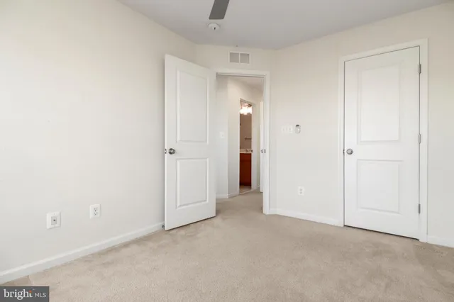 an empty room with closet area