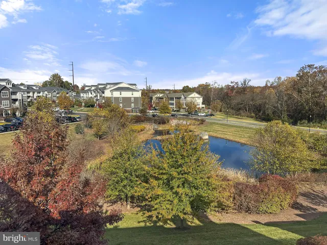 a view of a lake with houses in the background