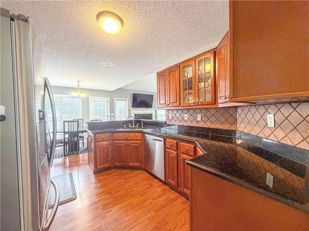 2950 Mandy Court Jonesboro, GA 30236 - Photo 12 of 40 a kitchen with stainless steel appliances granite countertop a stove a sink and a microwave