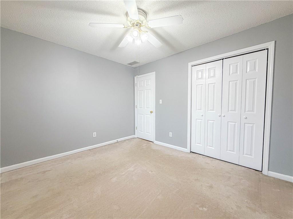 2950 Mandy Court Jonesboro, GA 30236 - Photo 17 of 40 an empty room with fan and windows