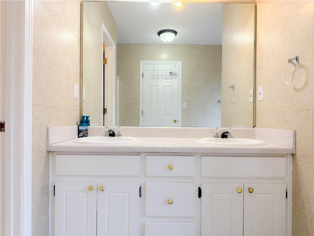 2950 Mandy Court Jonesboro, GA 30236 - Photo 23 of 40 a bathroom with a sink and a mirror