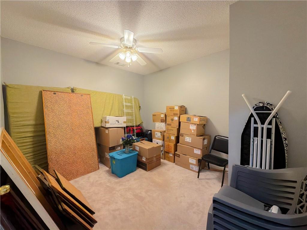 2950 Mandy Court Jonesboro, GA 30236 - Photo 27 of 40 a view of a livingroom with furniture and a fan