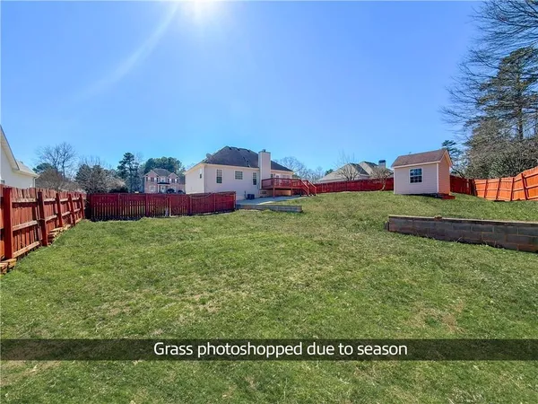 a view of backyard with green space