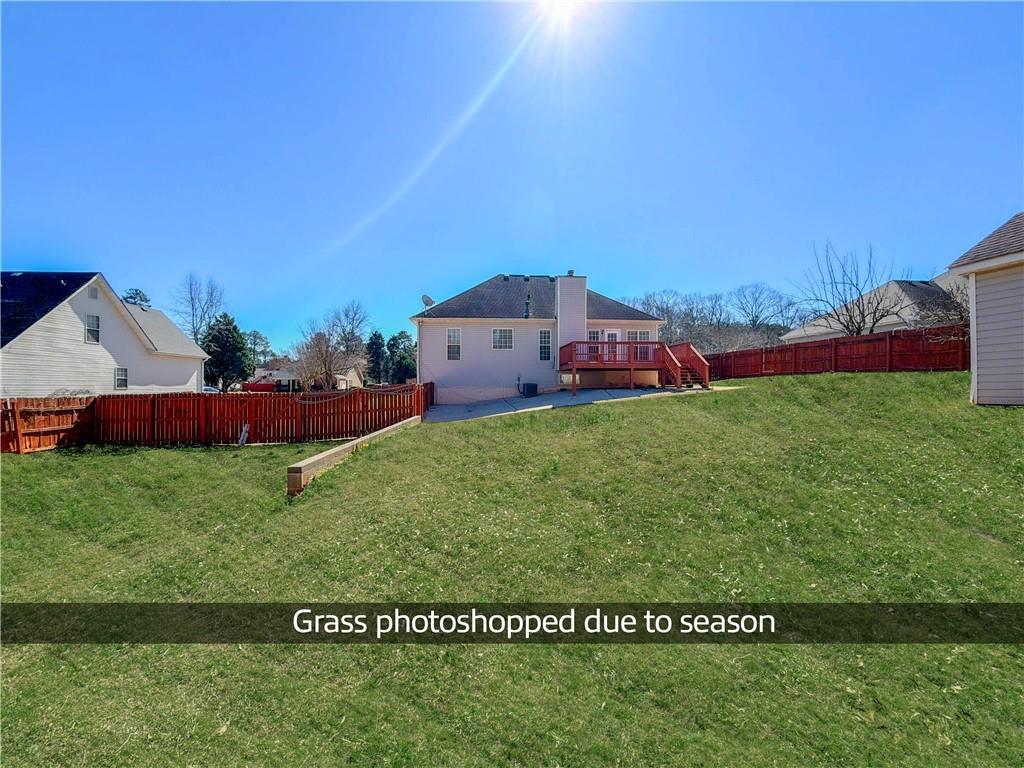 2950 Mandy Court Jonesboro, GA 30236 - Photo 35 of 40 a view of a house with a big yard and large trees