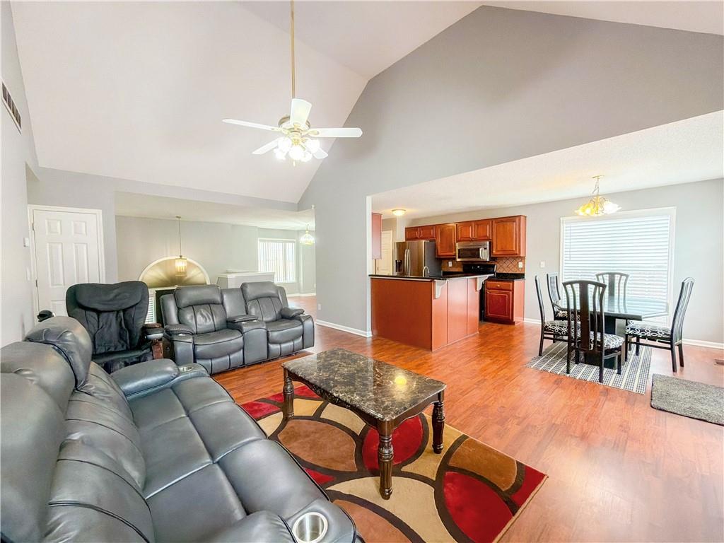 2950 Mandy Court Jonesboro, GA 30236 - Photo 9 of 40 a living room with furniture kitchen view and a chandelier