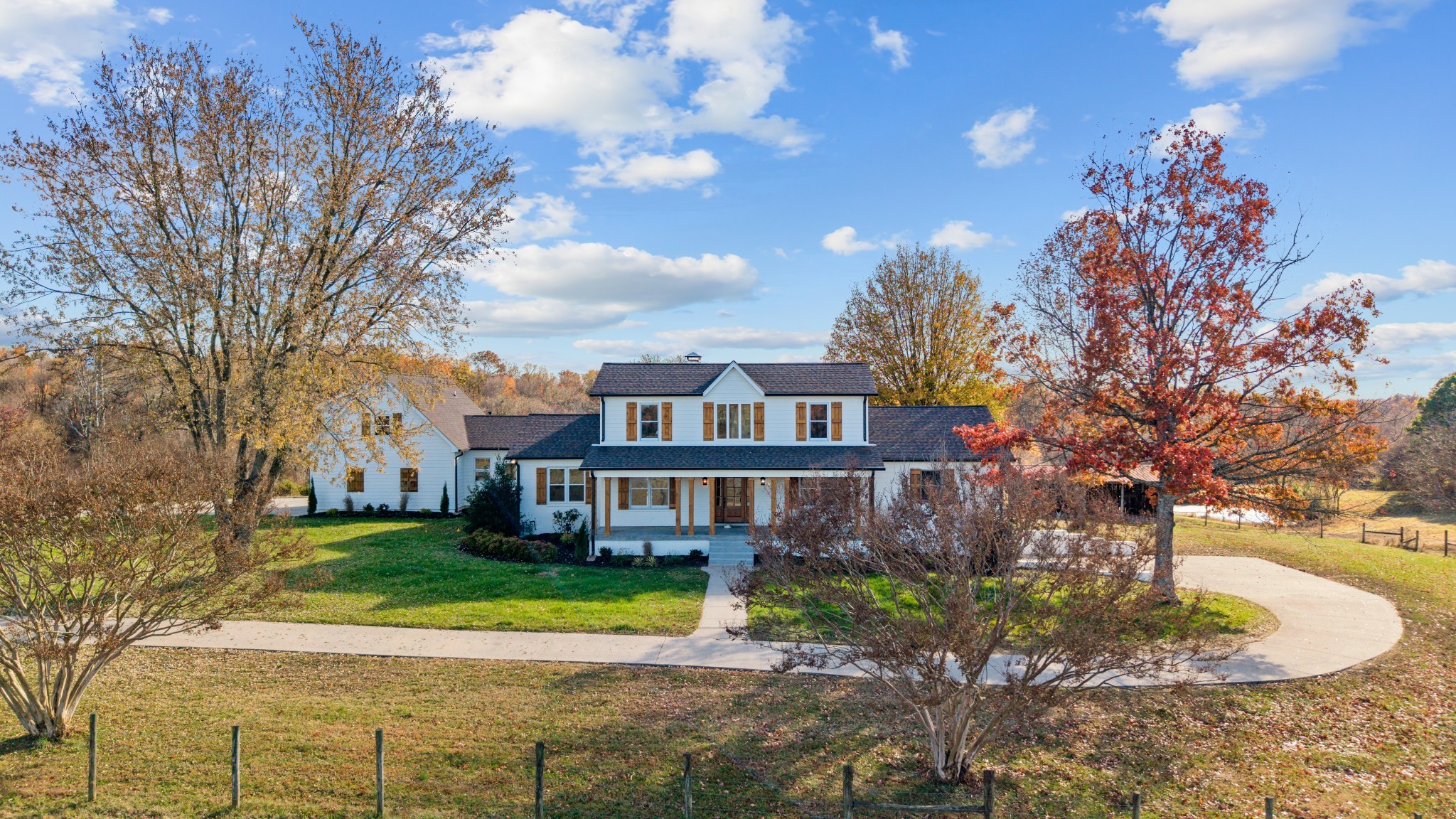 4818 Hickory Ridge Road Lebanon, TN 37087 - Photo 2 of 73 a front view of a house with a yard and large trees