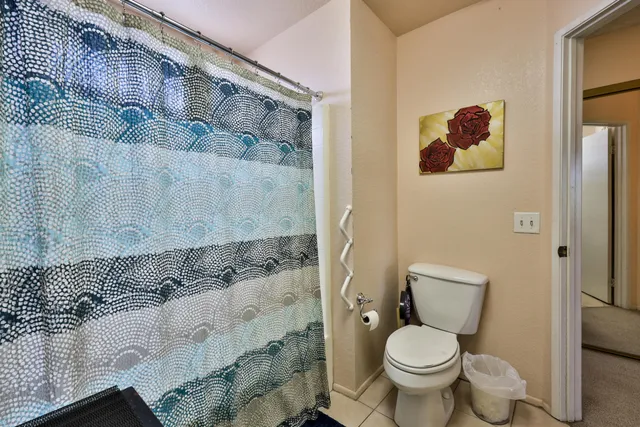 a white toilet sitting next to a bathroom sink