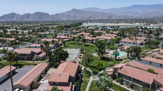 an aerial view of residential houses and outdoor space