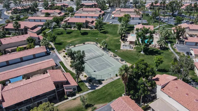 an aerial view of a houses with outdoor space and street view