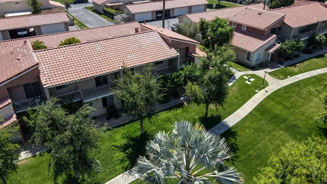an aerial view of a house with a garden and plants