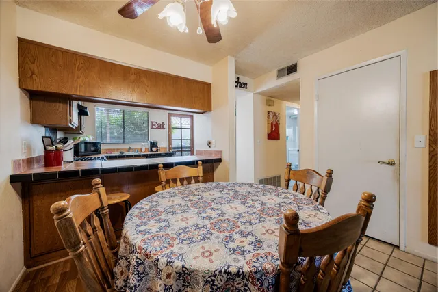 a dining room with furniture and window