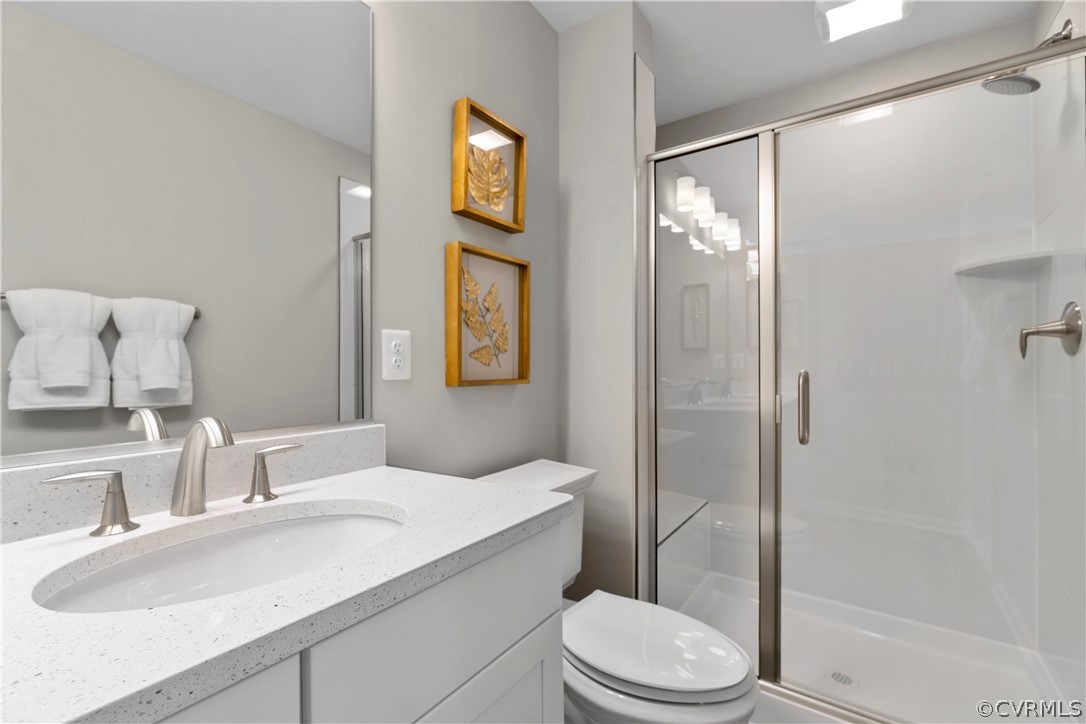 607 Rivanna Hill Road Glen Allen, VA 23060 - Photo 15 of 30 a bathroom with a sink toilet and shower