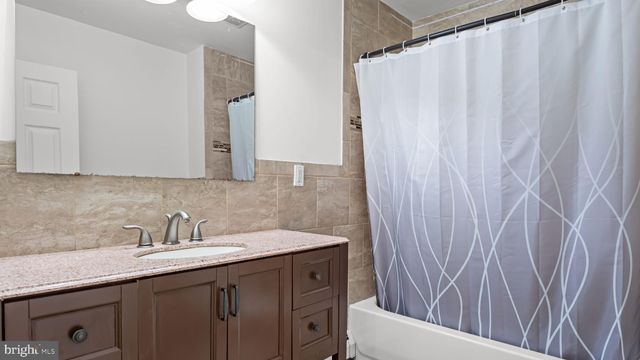 a bedroom with a bed and a flat tv screen