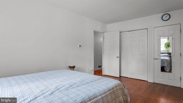 a very nice looking room with a large window and wooden floor