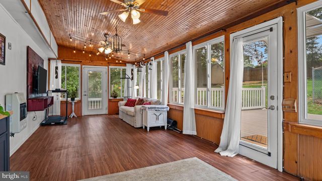 a view of a deck with a big yard