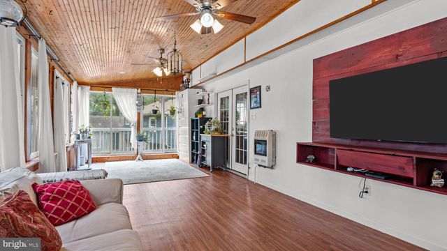 a view of a house with a garden and plants