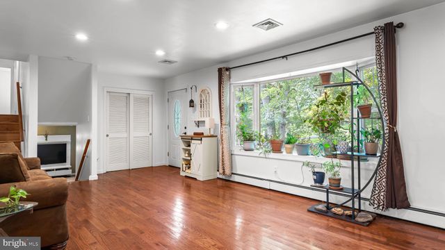 a view of a livingroom with furniture and a fireplace