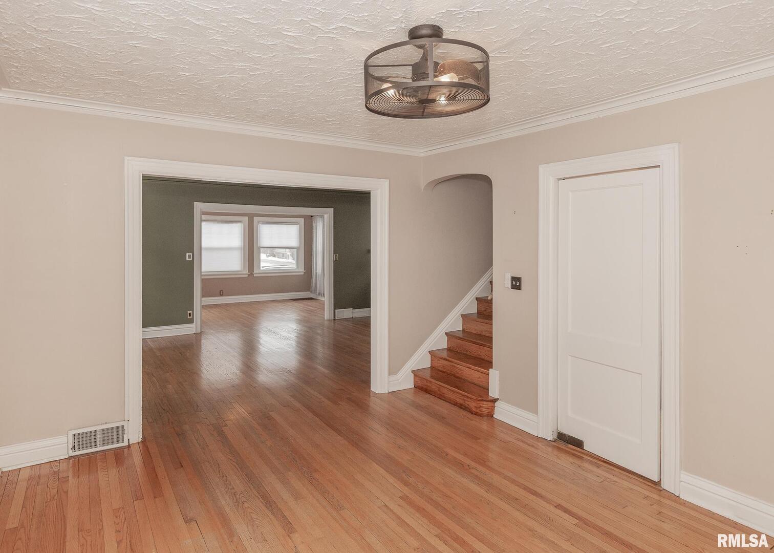 2416 12th Street Moline, IL 61265 - Photo 14 of 41 wooden floor in a hall with a window
