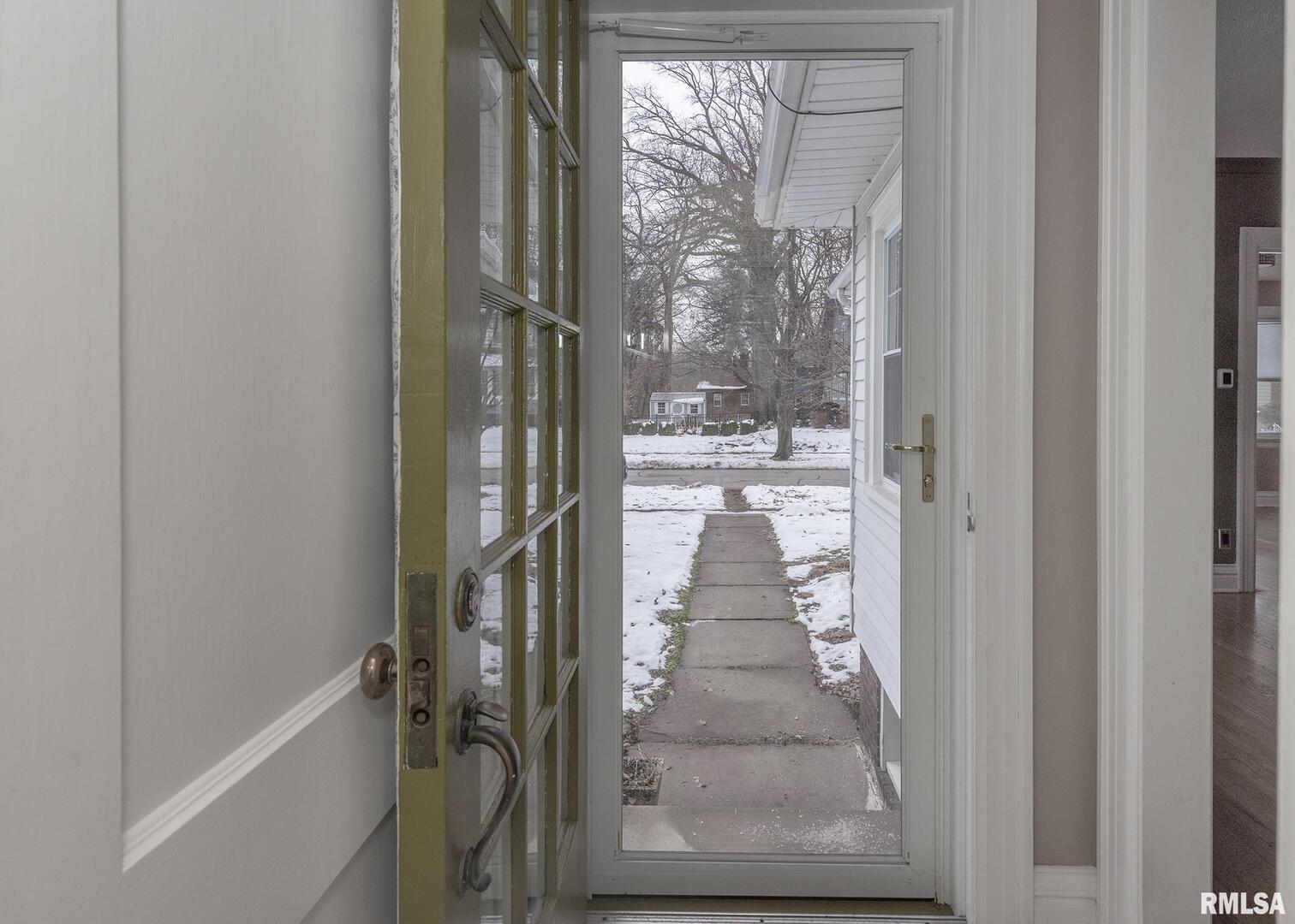 2416 12th Street Moline, IL 61265 - Photo 3 of 41 a bathroom with a glass door shower and sink