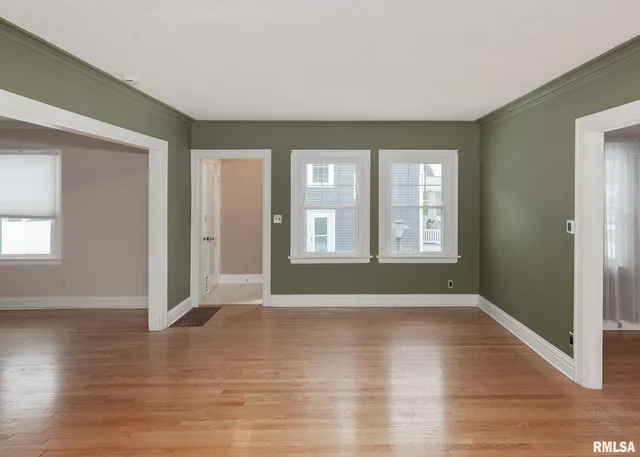 a view of livingroom with hardwood floor and hallway