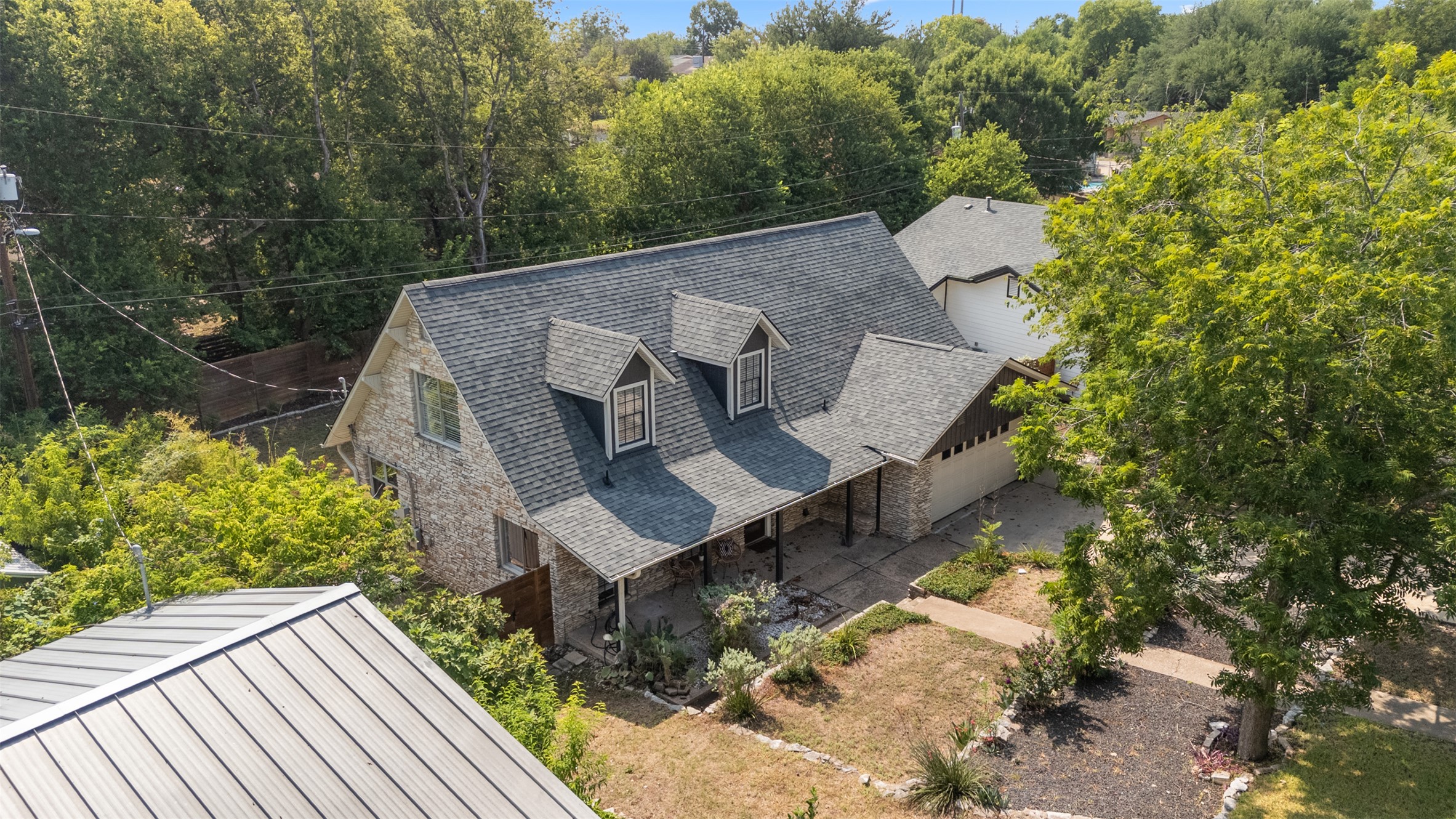 3405 Santa Fe Drive Austin, TX 78741 - Photo 2 of 23 View from above of property featuring a tree filled landscape