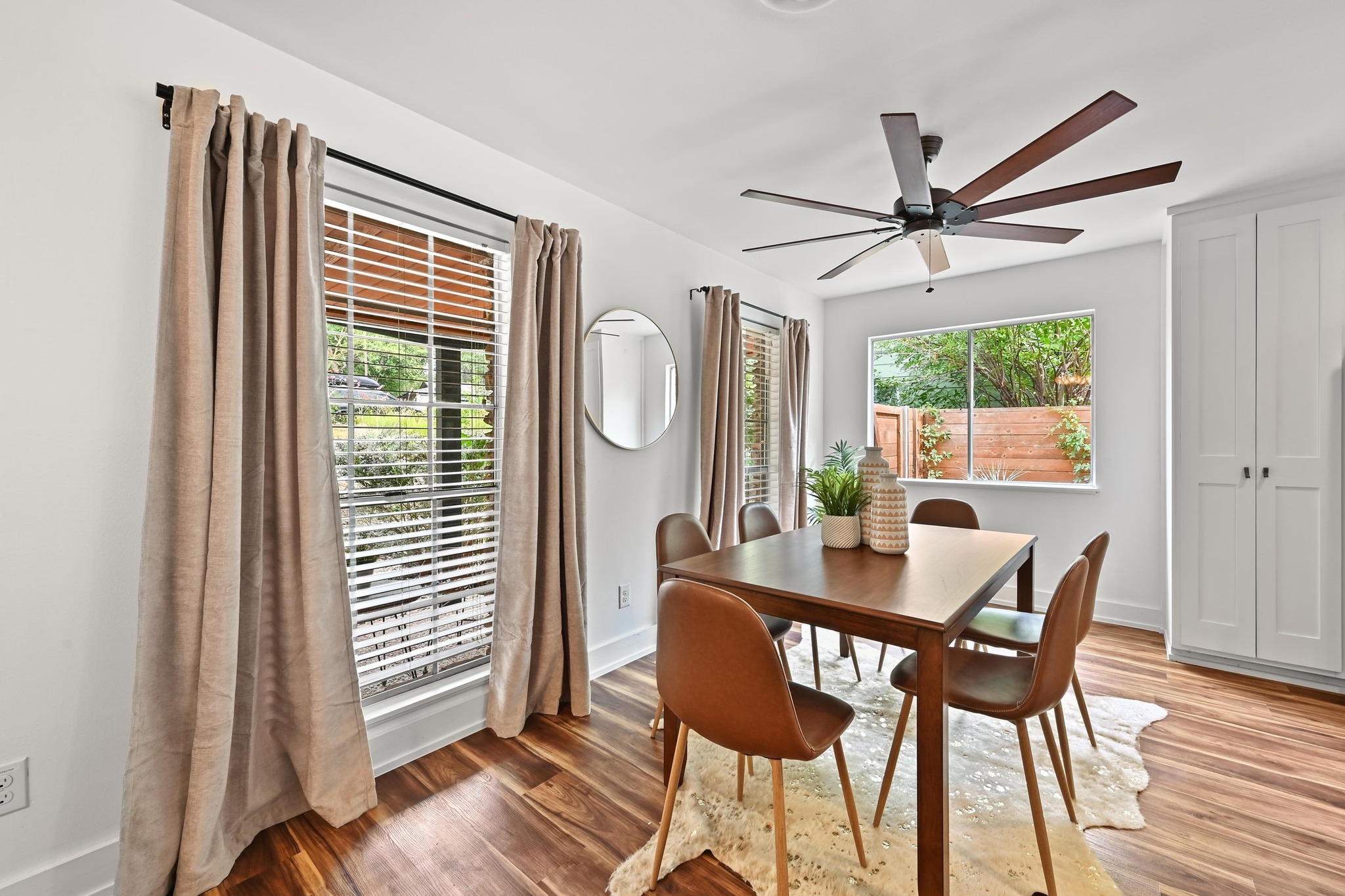 3405 Santa Fe Drive Austin, TX 78741 - Photo 8 of 23 Dining space featuring wood finished floors, healthy amount of natural light, and a ceiling fan