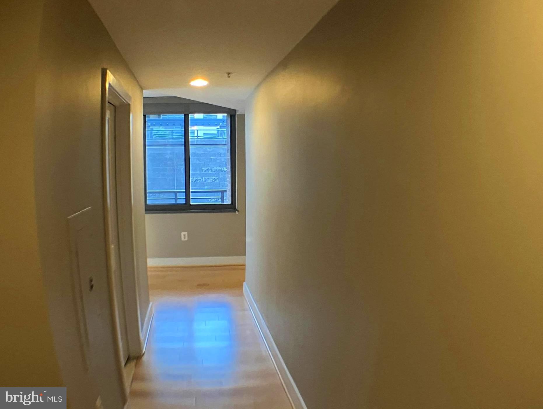 2001 15th Street North, Unit 319 Arlington, VA 22201 - Photo 13 of 19 a view of hallway with wooden floor