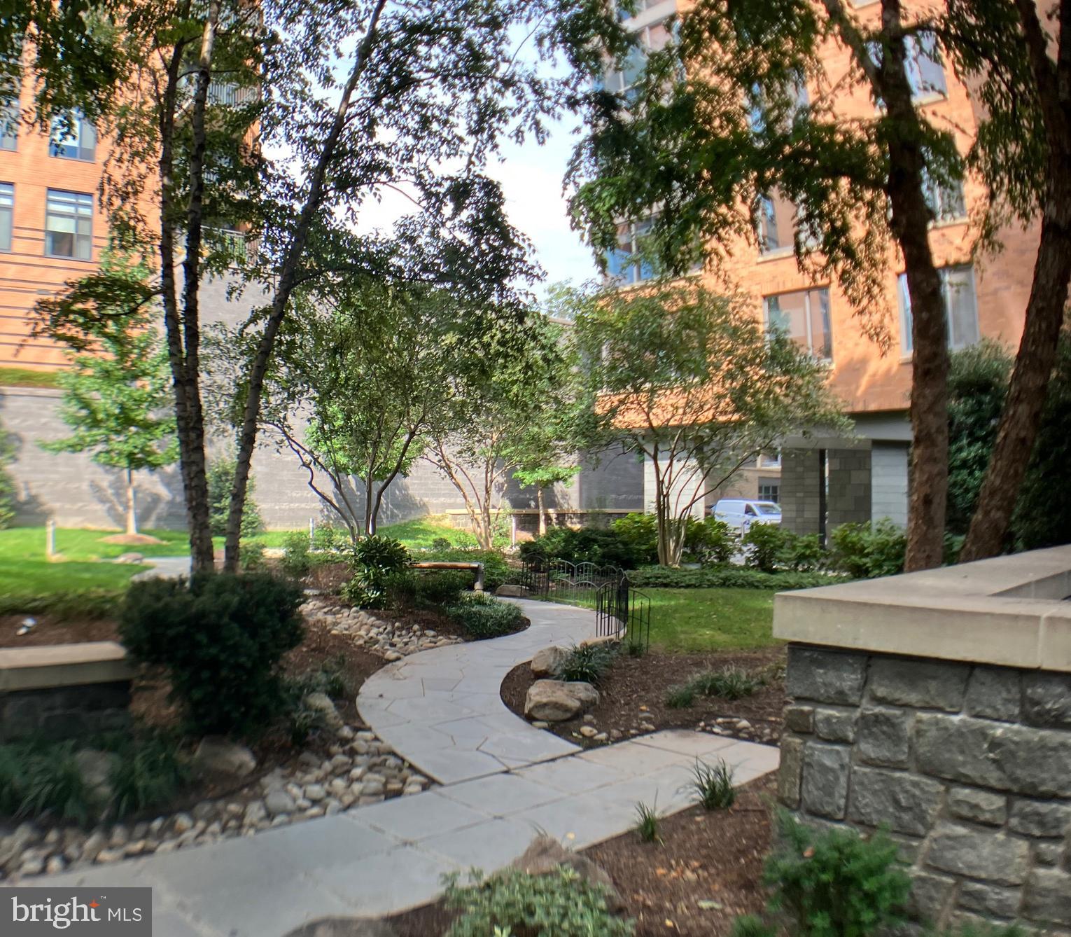 2001 15th Street North, Unit 319 Arlington, VA 22201 - Photo 2 of 19 a view of a garden with a house