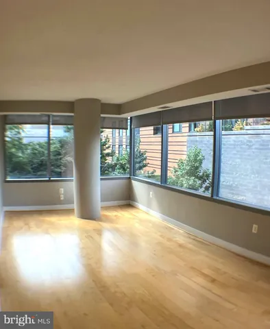 a view of an empty room with a large window