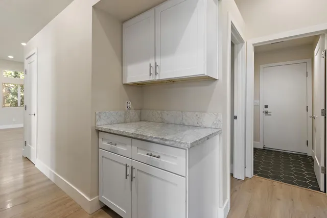 a view of cabinets and wooden floor