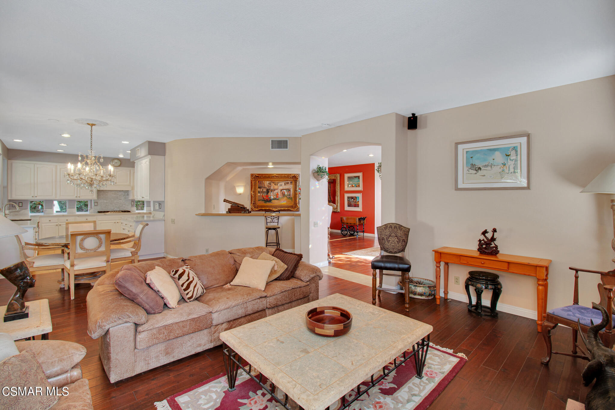 11603 Pinedale Road Moorpark, CA 93021 - Photo 20 of 54 a living room with furniture and a dining table with wooden floor