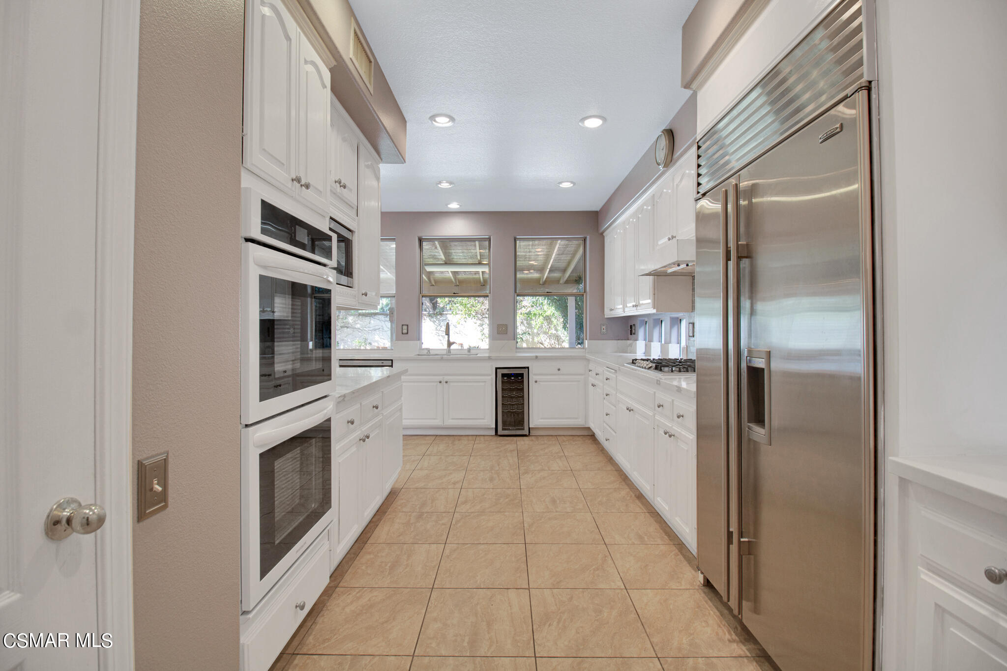 11603 Pinedale Road Moorpark, CA 93021 - Photo 9 of 54 a large kitchen with cabinets and stainless steel appliances