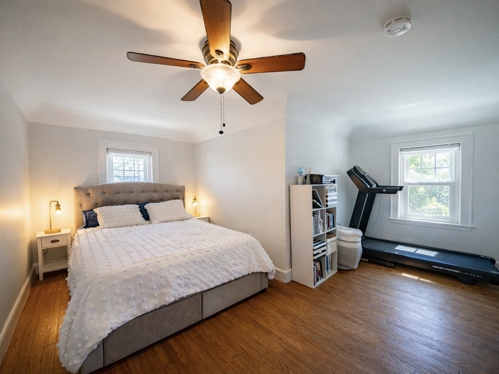10 Guild Road Saugus, MA 01906 - Photo 24 of 32 a bedroom with a bed window and a chandelier