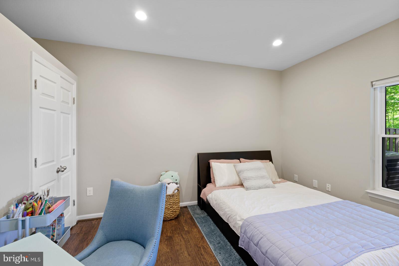 20713 Riptide Square Sterling, VA 20165 - Photo 25 of 65 a bedroom with a bed and a couch