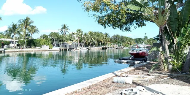 a view of a lake in between two chairs