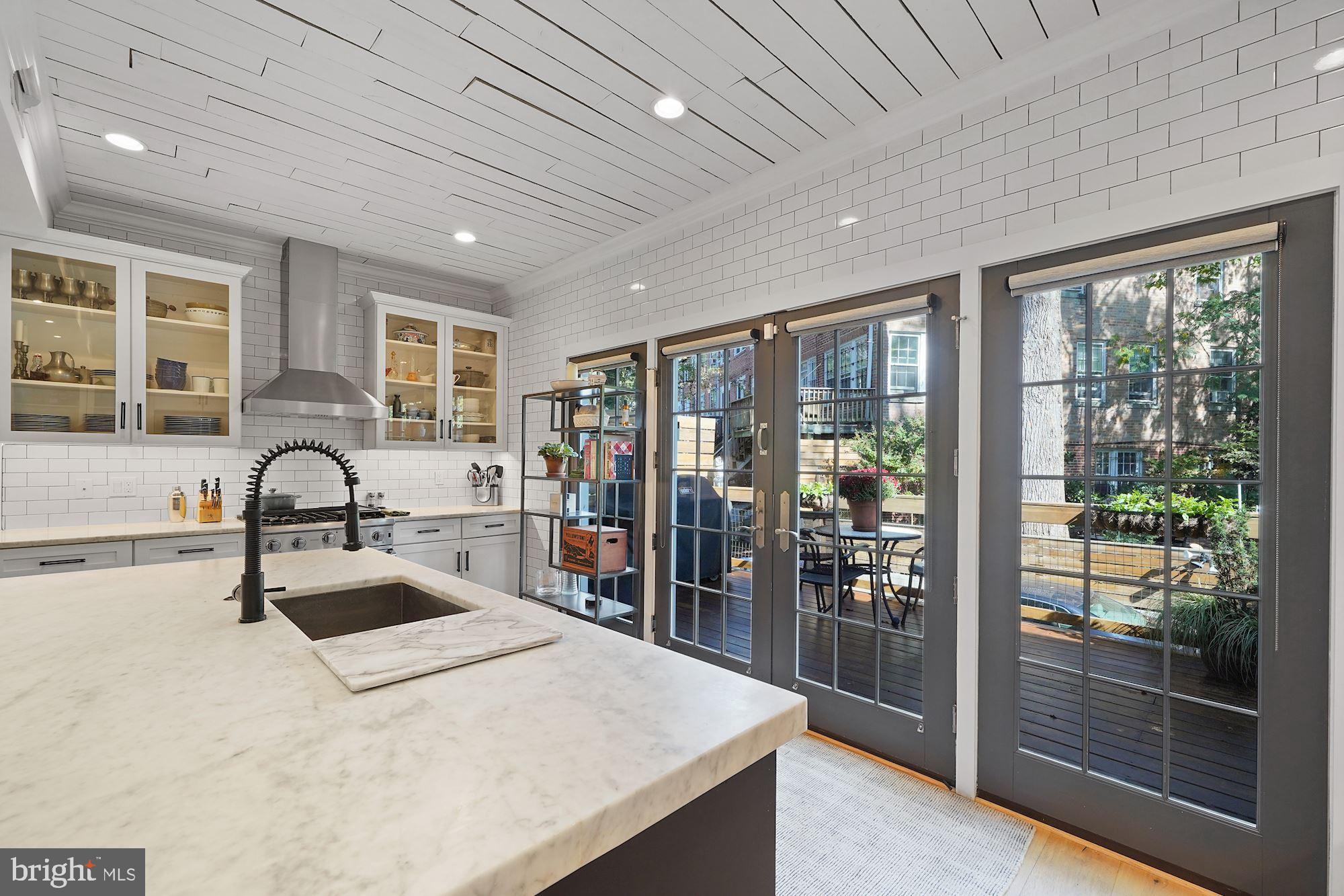 3213 Adams Mill Road Northwest Washington, DC 20010 - Photo 11 of 43 Wall of windows/doors opens to back deck