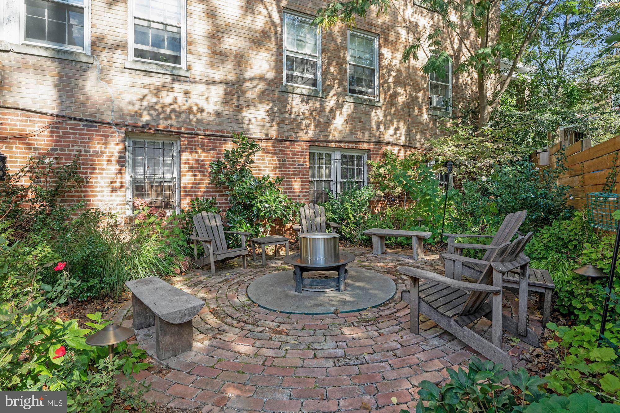 3213 Adams Mill Road Northwest Washington, DC 20010 - Photo 33 of 43 Large yard with fire pit with uplighting