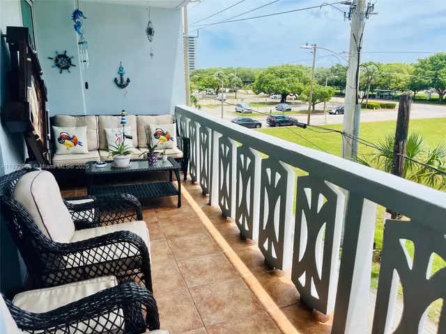 a view of balcony with furniture