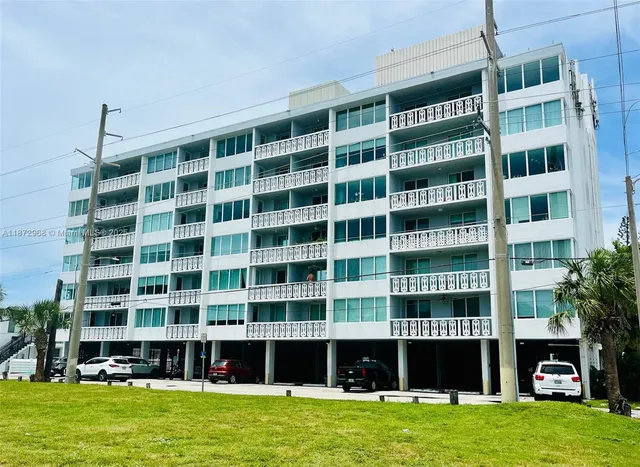 a view of a large building with a big yard