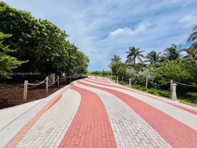 a view of balcony with wooden floor and fence