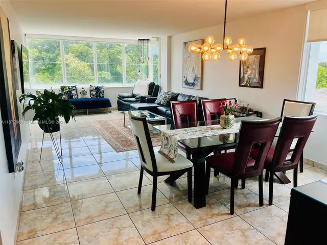 a view of a dining room with furniture window and outside view
