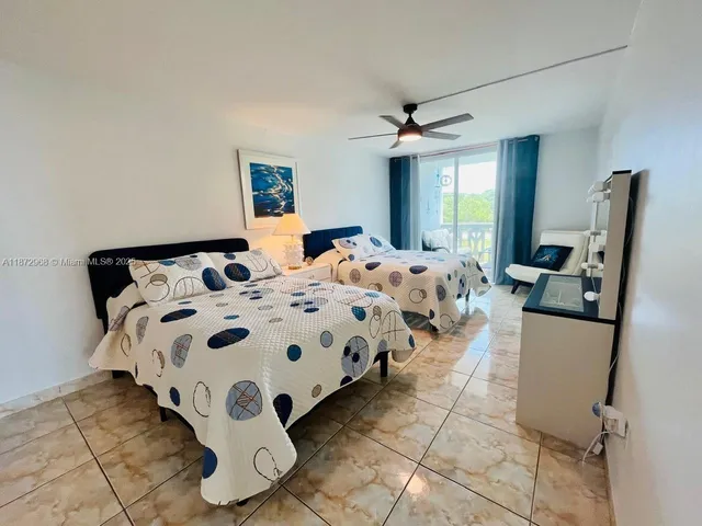 a bedroom with bed and a window