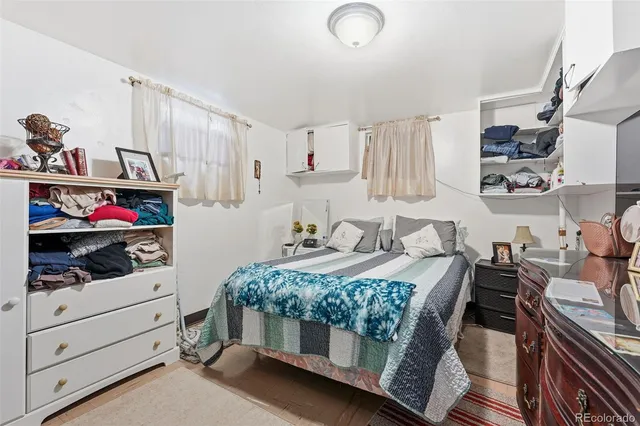 a bedroom with a bed and a closet