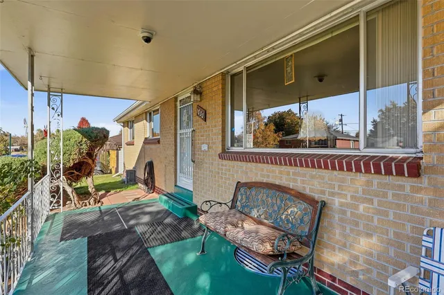 a view of a balcony with chairs