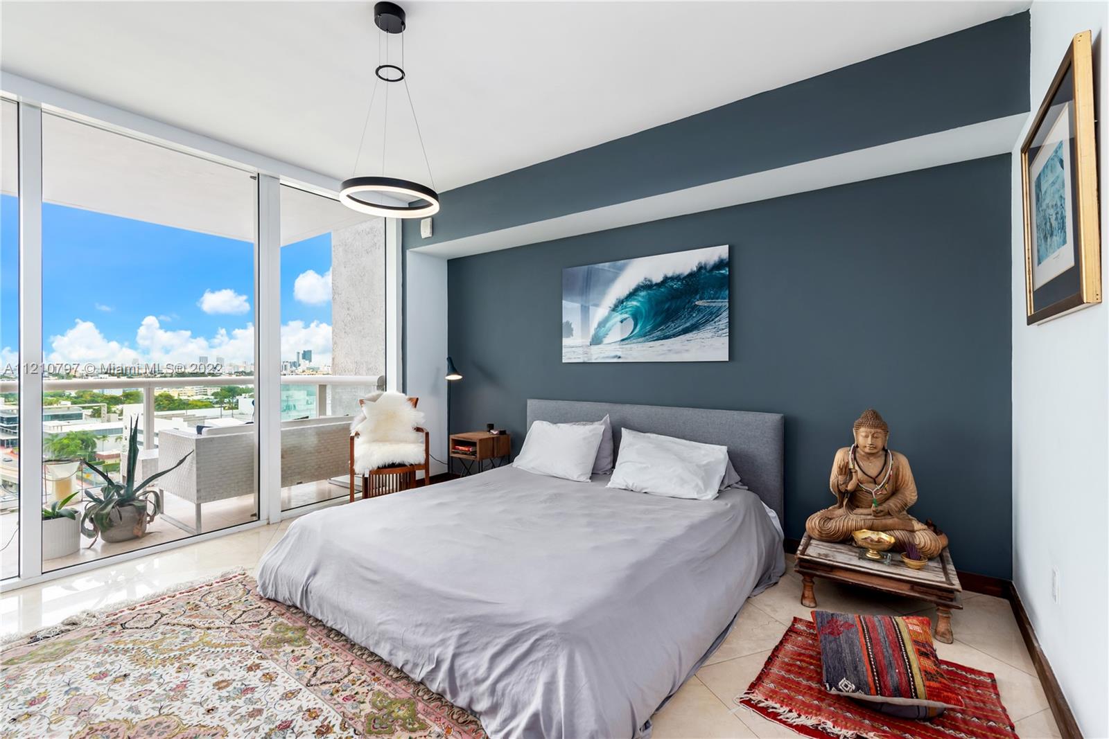 450 Alton Road, Unit 1404 Miami Beach, FL 33139 - Photo 12 of 33 a bedroom with a bed and wooden floor