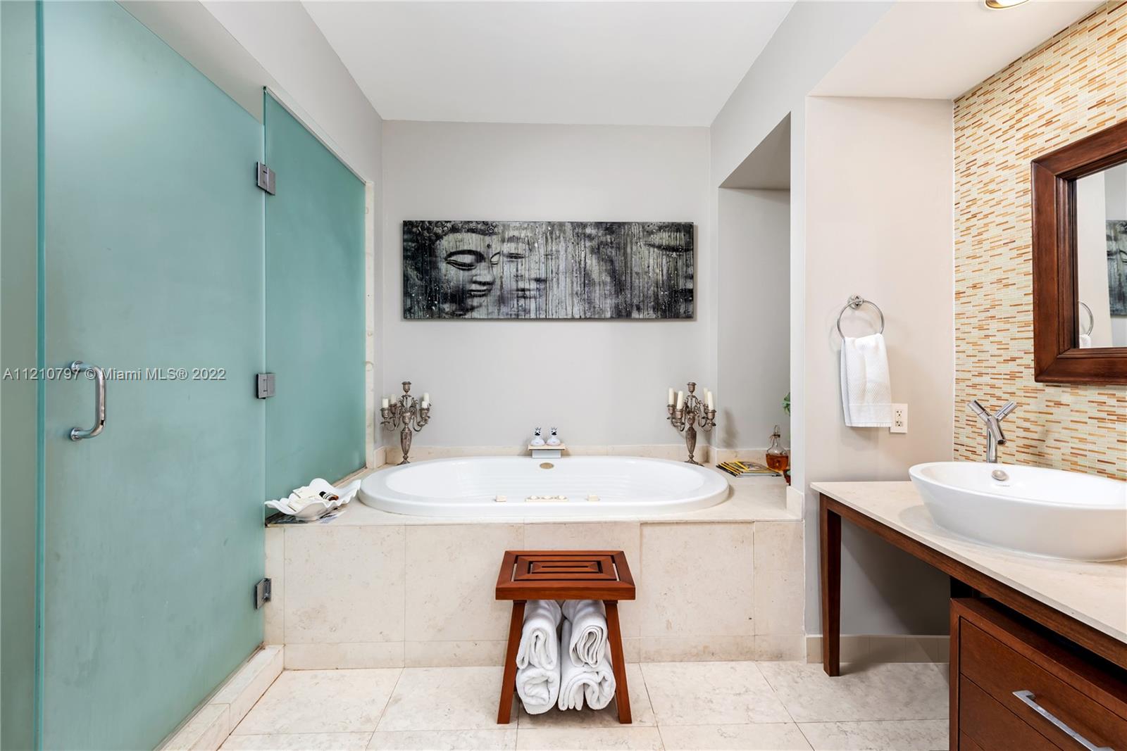 450 Alton Road, Unit 1404 Miami Beach, FL 33139 - Photo 14 of 33 a bathroom with a sink and a mirror