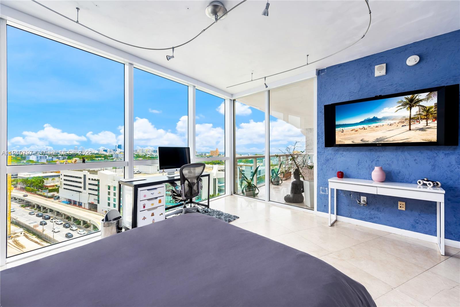450 Alton Road, Unit 1404 Miami Beach, FL 33139 - Photo 17 of 33 a view of a living room and a flat screen tv